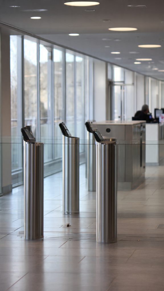 pedestrian barriers vs speed gates, access control solutions, office access control, Johannesburg office security, pedestrian barriers, speed gates, turnstiles, access control systems, Johannesburg access control, Roodepoort security, Randburg security, West Rand security, Sandton office security, Rosebank office security, Bryanston security systems, Johannesburg offices, South Africa access control, speed gate systems, pedestrian barrier systems, tripod turnstiles, full height turnstiles, swing gates, mechanical turnstiles, electronic speed gates, automatic barriers, security turnstiles, access control turnstiles, boom gates and turnstiles, biometric access control, card reader systems, keypad access control, facial recognition access control, tailgating prevention, infrared sensors, access control readers, anti-tailgating systems, touchless access control, smart security solutions, commercial security systems, office security solutions, corporate access control, business security systems, workplace security, commercial building security, office lobby security, reception area security, employee access control, visitor management systems, access control installation, security system installation, access control integration, building management systems, access control software, security infrastructure, CCTV integration, alarm system integration, biometric scanners, access credentials, access control providers, security installers, access control maintenance, 24/7 security support, security consultation, professional installation, security assessment, access control setup, turnstile installation, speed gate installation, high traffic access control, secure entry systems, authorized access, unauthorized access prevention, traffic flow management, security efficiency, cost effective security, durable access control, weather resistant barriers, silent operation gates, traditional barriers vs modern gates, mechanical vs electronic access control, turnstile vs speed gate, access control comparison, security system comparison, barrier systems comparison, cost comparison access control, ROI access control systems, office security bottlenecks, peak hour congestion, tailgating prevention, unauthorized entry prevention, visitor access management, employee flow management, security queue reduction, access control efficiency, workplace access security, corporate security, data center security, government office security, manufacturing facility security, warehouse security, professional office security, high security environments, restricted area access, which access control solution is right for my office, how to choose between pedestrian barriers and speed gates, best access control for high traffic offices, modern office access control systems Johannesburg, speed gate installation costs South Africa, pedestrian barrier maintenance requirements, office security system integration, tailgating prevention technology, wheelchair accessible access control, silent access control solutions, access control costs, speed gate prices, turnstile installation costs, security system investment, access control ROI, budget security solutions, affordable access control, premium access control systems, cost effective office security, smart security integration, building automation integration, visitor management integration, security platform integration, centralized security monitoring, multi-system integration, comprehensive security layers, network security protocols, access control maintenance, turnstile servicing, speed gate calibration, security system updates, preventive maintenance, technical support, system troubleshooting, equipment maintenance, security system upkeep, modern office aesthetics, professional lobby appearance, sleek security design, contemporary access control, glass panel barriers, stainless steel turnstiles, elegant security solutions, office interior design security