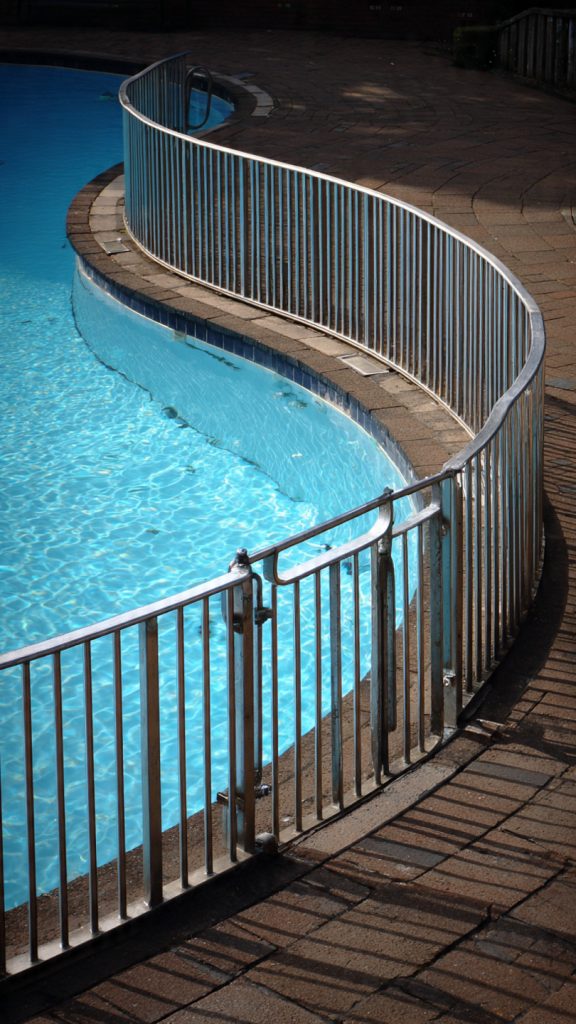 pedestrian barrier regulations, SANS compliance, SANS 10400, property managers South Africa, pedestrian safety barriers, building regulations South Africa, SANS 10400 Part D, Roodepoort security, Randburg security, West Rand property management, Johannesburg pedestrian barriers, South African building codes, Cape Town barrier regulations, property managers Roodepoort, property managers Randburg, pedestrian barrier height requirements, balustrade regulations, parapet wall standards, ramp gradient specifications, wheelchair accessible ramps, SANS 10400-S, building code compliance, municipal by-laws South Africa, occupancy certificate requirements, compliance audits, electric fence regulations, electric fence compliance, perimeter security barriers, wall-top electric fencing, barrier fence installation, security barrier systems, electric fence height requirements, SANS electric fence standards, boom gates South Africa, turnstile installation, access control barriers, CCTV systems, alarm systems, smart home automation, biometric access control, security system installation, integrated security solutions, swimming pool barriers, pool fence regulations, SANS 10134, pedestrian access control, vehicle pedestrian separation, safety ramp requirements, fall protection barriers, elevated surface protection, mezzanine barriers, balcony safety regulations, residential security systems, commercial security barriers, industrial safety barriers, multi-dwelling properties, estate security, parking area safety, mixed-use property barriers, warehouse safety barriers, security company Roodepoort, security installation Randburg, professional barrier installation, security compliance assessment, SAPVIA certification, certified security installers, 24/7 security support, security maintenance services, building inspector requirements, liability protection, insurance compliance, regulatory violations, safety audits, permit requirements, non-compliance consequences, legal requirements barriers, building standards enforcement, PAS 13 standard, British Standards Institute, international safety standards, global safety barriers, workplace safety barriers, barrier impact resilience, safety barrier testing, visibility standards, retrofit barrier installation, compliance solutions, older property upgrades, safety violation corrections, emergency egress requirements, fail-safe barrier systems, accident prevention, pedestrian collision prevention, how to comply with SANS 10400 pedestrian barriers, pedestrian barrier height requirements South Africa, electric fence regulations for property managers, swimming pool barrier compliance SANS 10134, boom gate installation requirements, cost of compliant barrier systems, professional security barrier installation Roodepoort, integrated access control and barriers, pedestrian safety compliance checklist, property manager compliance responsibilities, barrier compliance assessment, security system installation quote, professional compliance consultation, barrier system maintenance, compliance documentation, regulatory inspection preparation, safety audit services, barrier retrofit solutions, property management compliance, facility management safety, estate management security, body corporate requirements, HOA security regulations, tenant safety obligations, commercial property compliance, industrial facility barriers